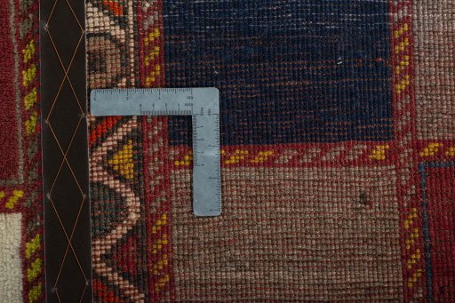 Corner detail of 2000s Persian Gabbeh rug showing border pattern and Wool pile