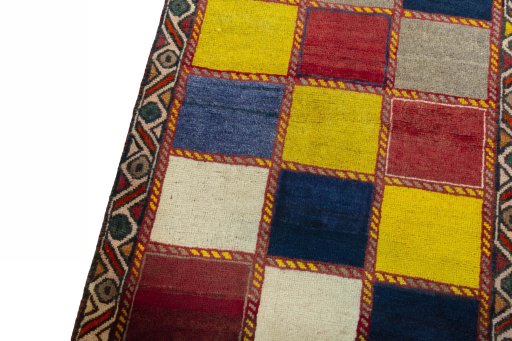 Backside of handmade 2000s Persian Gabbeh rug showing knot structure and weave density