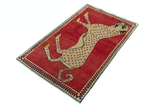 Corner detail of 2000s Persian Gabbeh rug showing border pattern and Wool pile