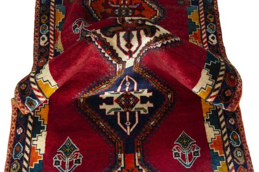 Corner detail of 2000s Persian Gabbeh rug showing border pattern and Wool pile