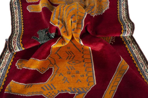 Corner detail of 2000s Persian Gabbeh rug showing border pattern and Wool pile