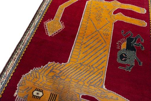 Backside of handmade 2000s Persian Gabbeh rug showing knot structure and weave density