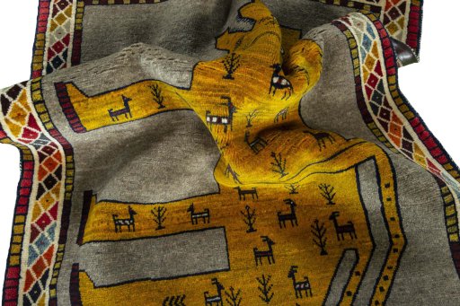 Corner detail of 2000s Persian Gabbeh rug showing border pattern and Wool pile
