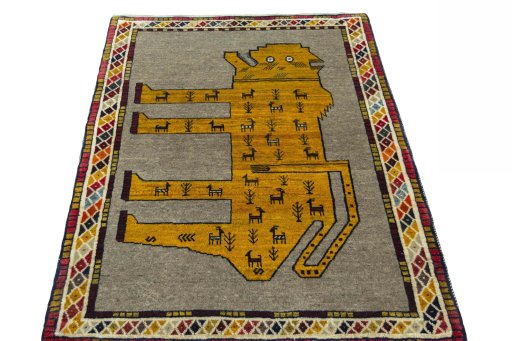 Surface texture of 2000s Persian Gabbeh rug with natural Wool and intricate pattern