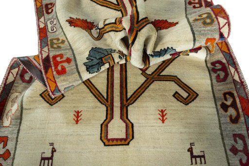 Corner detail of 2000s Persian Gabbeh rug showing border pattern and Wool pile