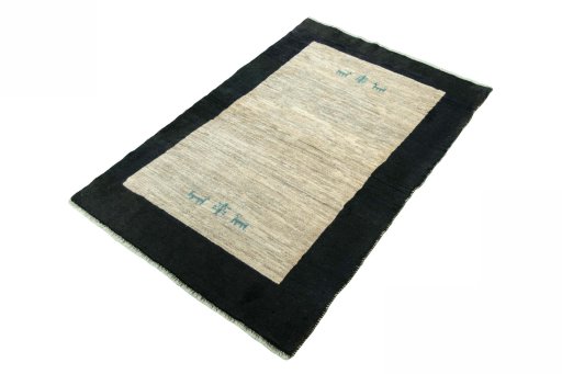 Corner detail of New Persian Gabbeh rug showing border pattern and Wool pile