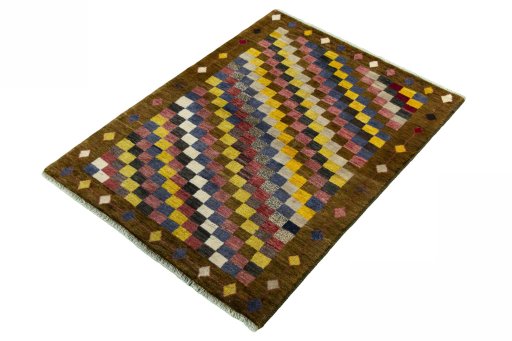 Corner detail of 2000s Persian Gabbeh rug showing border pattern and Wool pile