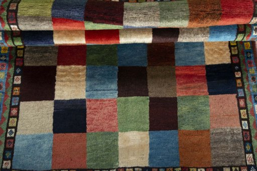 Full view of 2000s Persian Gabbeh rug from Iran / Persia, 161 × 103 cm in Multi Color tones