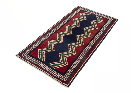Corner detail of 2000s Persian Gabbeh rug showing border pattern and Wool pile