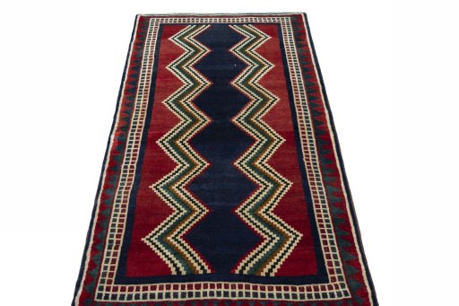 Surface texture of 2000s Persian Gabbeh rug with natural Wool and intricate pattern
