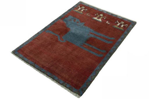 Corner detail of 2000s Persian Gabbeh rug showing border pattern and Wool pile