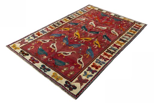 Corner detail of 2000s Persian Gabbeh rug showing border pattern and Wool pile