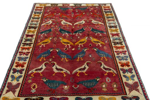 Surface texture of 2000s Persian Gabbeh rug with natural Wool and intricate pattern