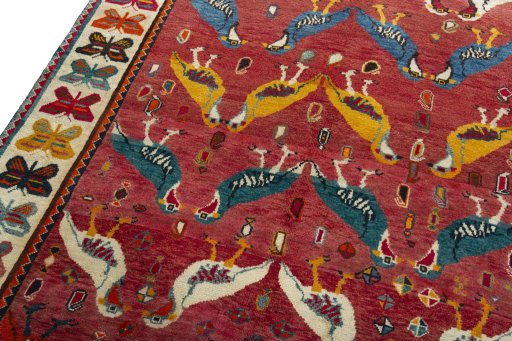 Backside of handmade 2000s Persian Gabbeh rug showing knot structure and weave density
