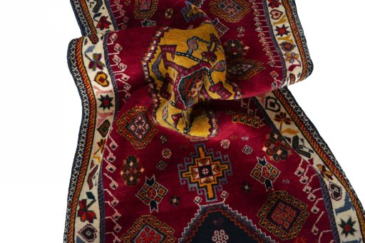 Corner detail of 2000s Persian Gabbeh rug showing border pattern and Wool pile