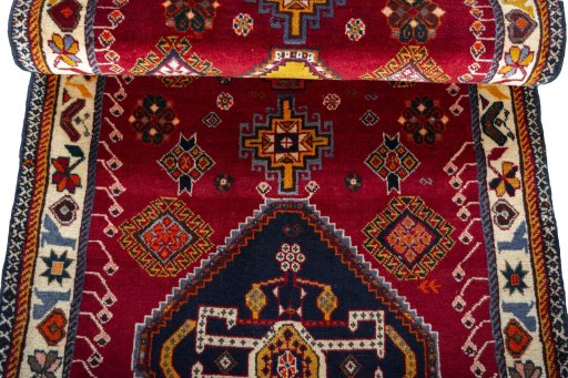 Full view of 2000s Persian Gabbeh rug from Iran / Persia, 200 × 84 cm in Red tones