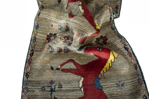 Corner detail of 2000s Persian Gabbeh rug showing border pattern and Wool pile