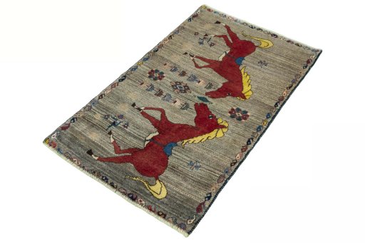 Corner detail of 2000s Persian Gabbeh rug showing border pattern and Wool pile