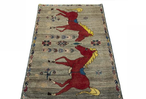 Surface texture of 2000s Persian Gabbeh rug with natural Wool and intricate pattern
