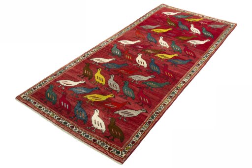 Corner detail of 2000s Persian Gabbeh rug showing border pattern and Wool pile