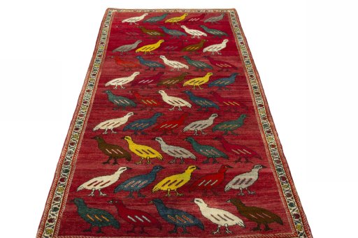 Surface texture of 2000s Persian Gabbeh rug with natural Wool and intricate pattern