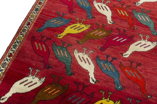 Backside of handmade 2000s Persian Gabbeh rug showing knot structure and weave density
