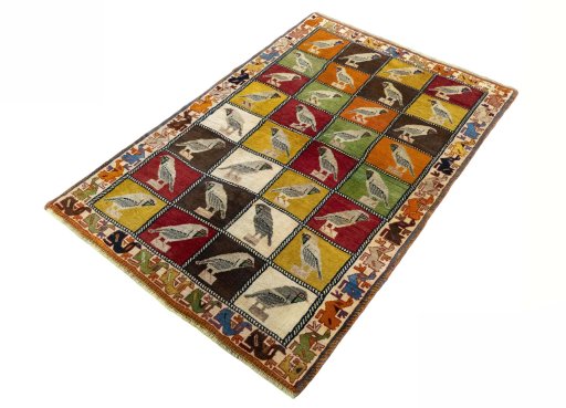 Corner detail of 1970s Persian Gabbeh rug showing border pattern and Wool pile