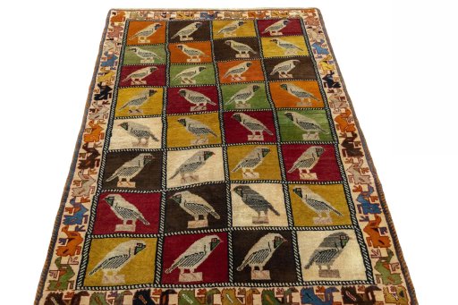 Surface texture of 1970s Persian Gabbeh rug with natural Wool and intricate pattern