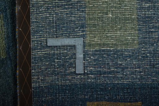 Surface texture of 2000s Persian Gabbeh rug with natural Wool and intricate pattern