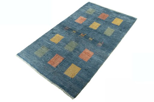 Corner detail of 2000s Persian Gabbeh rug showing border pattern and Wool pile