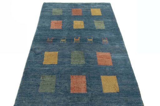 Surface texture of 2000s Persian Gabbeh rug with natural Wool and intricate pattern