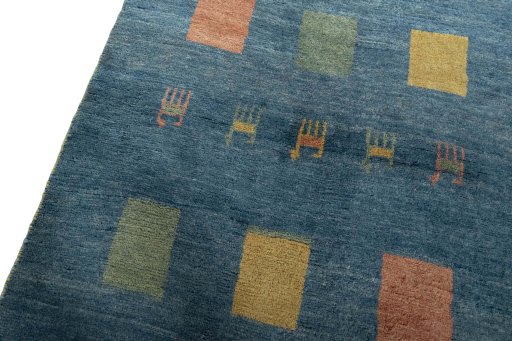 Backside of handmade 2000s Persian Gabbeh rug showing knot structure and weave density
