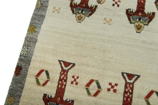 Backside of handmade 2000s Persian Gabbeh rug showing knot structure and weave density