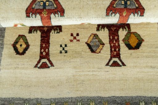 Full view of 2000s Persian Gabbeh rug from Iran / Persia, 117 × 81 cm in Beige tones