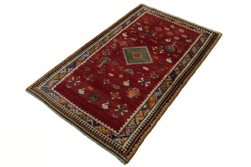 Corner detail of 2000s Persian Gabbeh rug showing border pattern and Wool pile