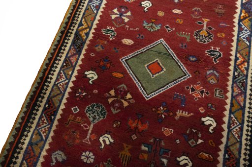 Backside of handmade 2000s Persian Gabbeh rug showing knot structure and weave density