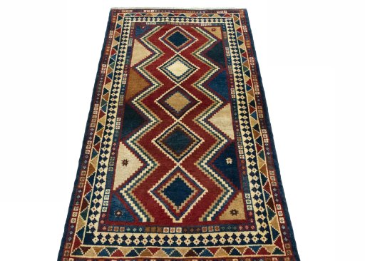 Surface texture of 2000s Persian Gabbeh rug with natural Wool and intricate pattern
