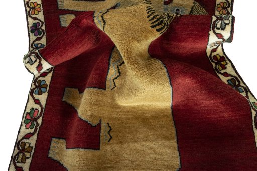 Corner detail of 2000s Persian Gabbeh rug showing border pattern and Wool pile