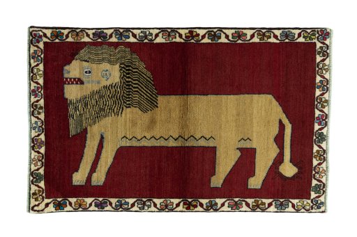 Full view of 2000s Persian Gabbeh rug from Iran / Persia, 167 × 105 cm in Red tones