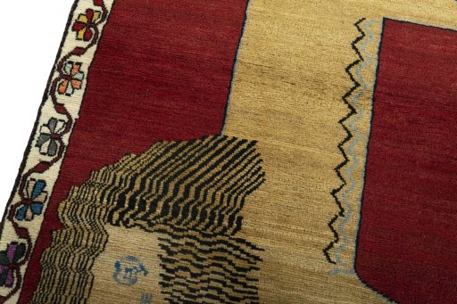 Backside of handmade 2000s Persian Gabbeh rug showing knot structure and weave density