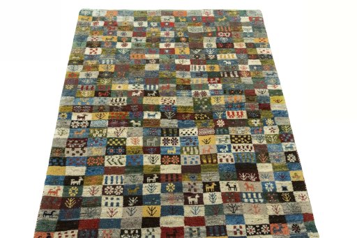 Surface texture of 2000s Persian Gabbeh rug with natural Wool and intricate pattern
