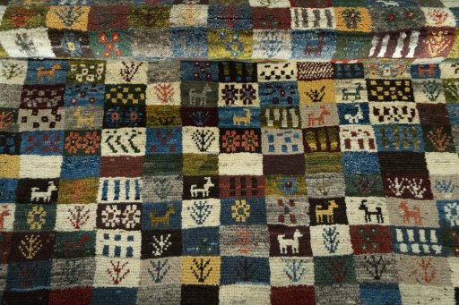 Full view of 2000s Persian Gabbeh rug from Iran / Persia, 176 × 125 cm in Multi Color tones