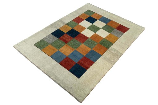 Corner detail of 2000s Persian Gabbeh rug showing border pattern and Wool pile