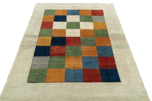 Surface texture of 2000s Persian Gabbeh rug with natural Wool and intricate pattern