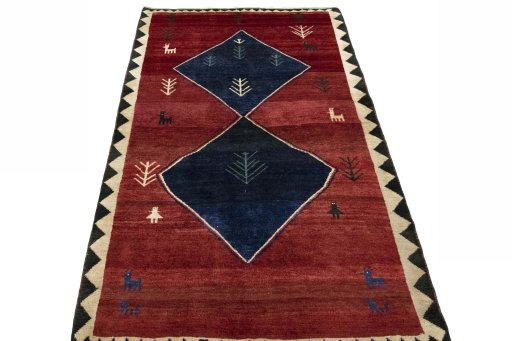 Surface texture of 2000s Persian Gabbeh rug with natural Wool and intricate pattern