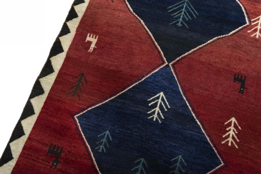 Backside of handmade 2000s Persian Gabbeh rug showing knot structure and weave density