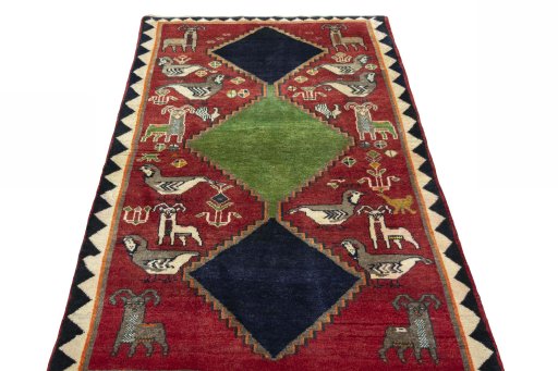 Surface texture of 2000s Persian Gabbeh rug with natural Wool and intricate pattern