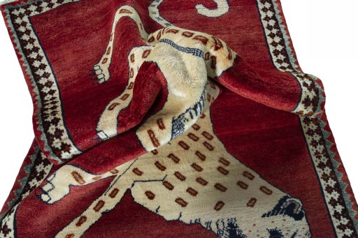 Corner detail of 2000s Persian Gabbeh rug showing border pattern and Wool pile