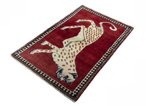 Corner detail of 2000s Persian Gabbeh rug showing border pattern and Wool pile