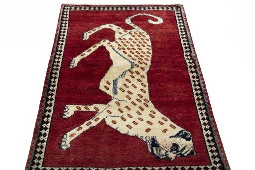 Surface texture of 2000s Persian Gabbeh rug with natural Wool and intricate pattern
